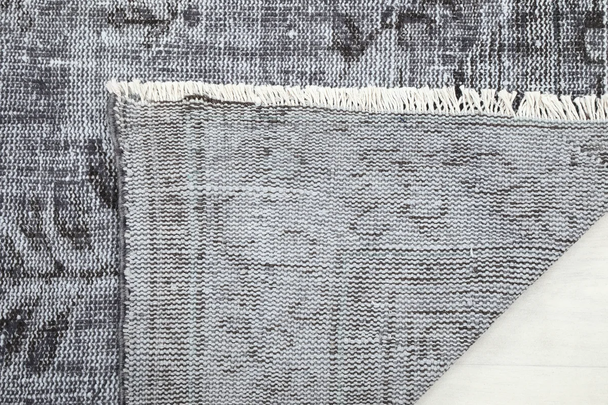 Close-up of the reverse side and fringe of the Charcoal Medallion Anatolian Rug