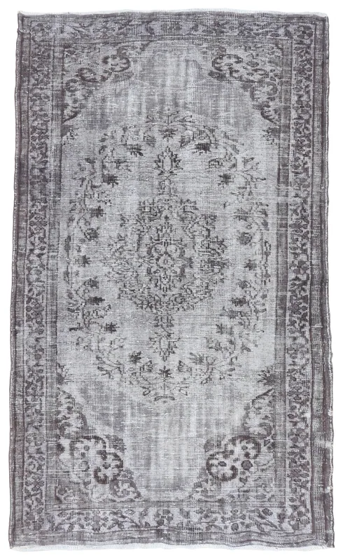 Full overhead view of the 4'9" x 8'0" vintage gray Anatolian rug with a central medallion.