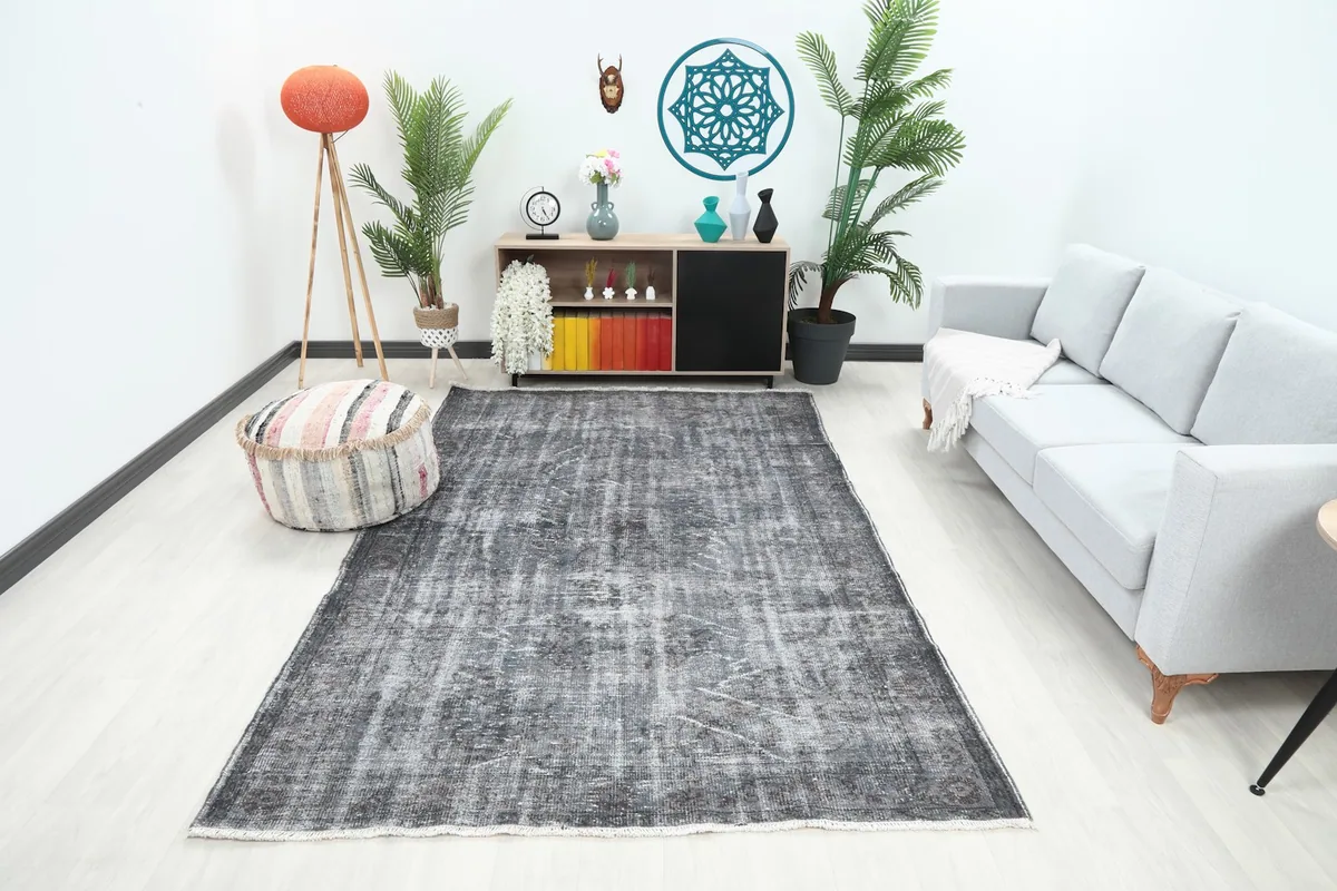Charcoal gray vintage rug in a modern living room setting