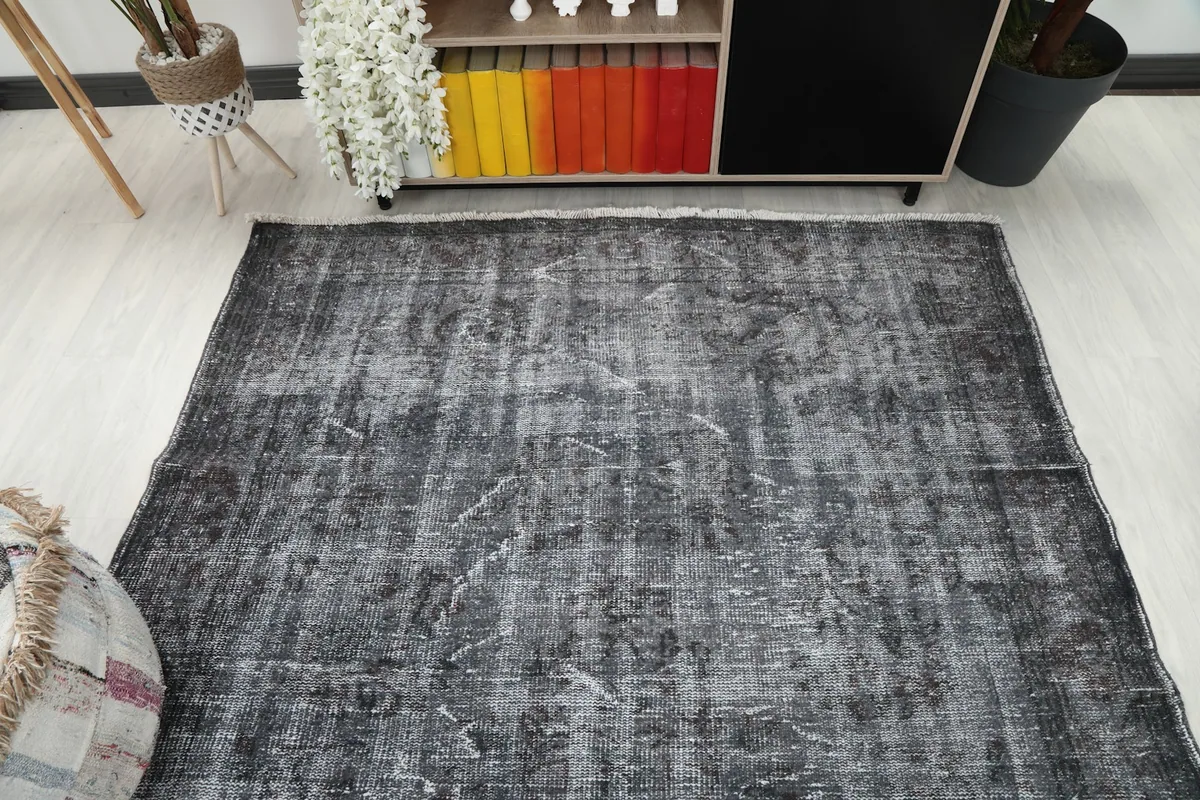 Overhead view showing the full length and width of the charcoal gray vintage rug