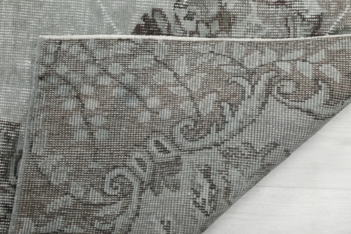 Underside of the rug, showing the reverse of the hand-knotted construction and cotton foundation