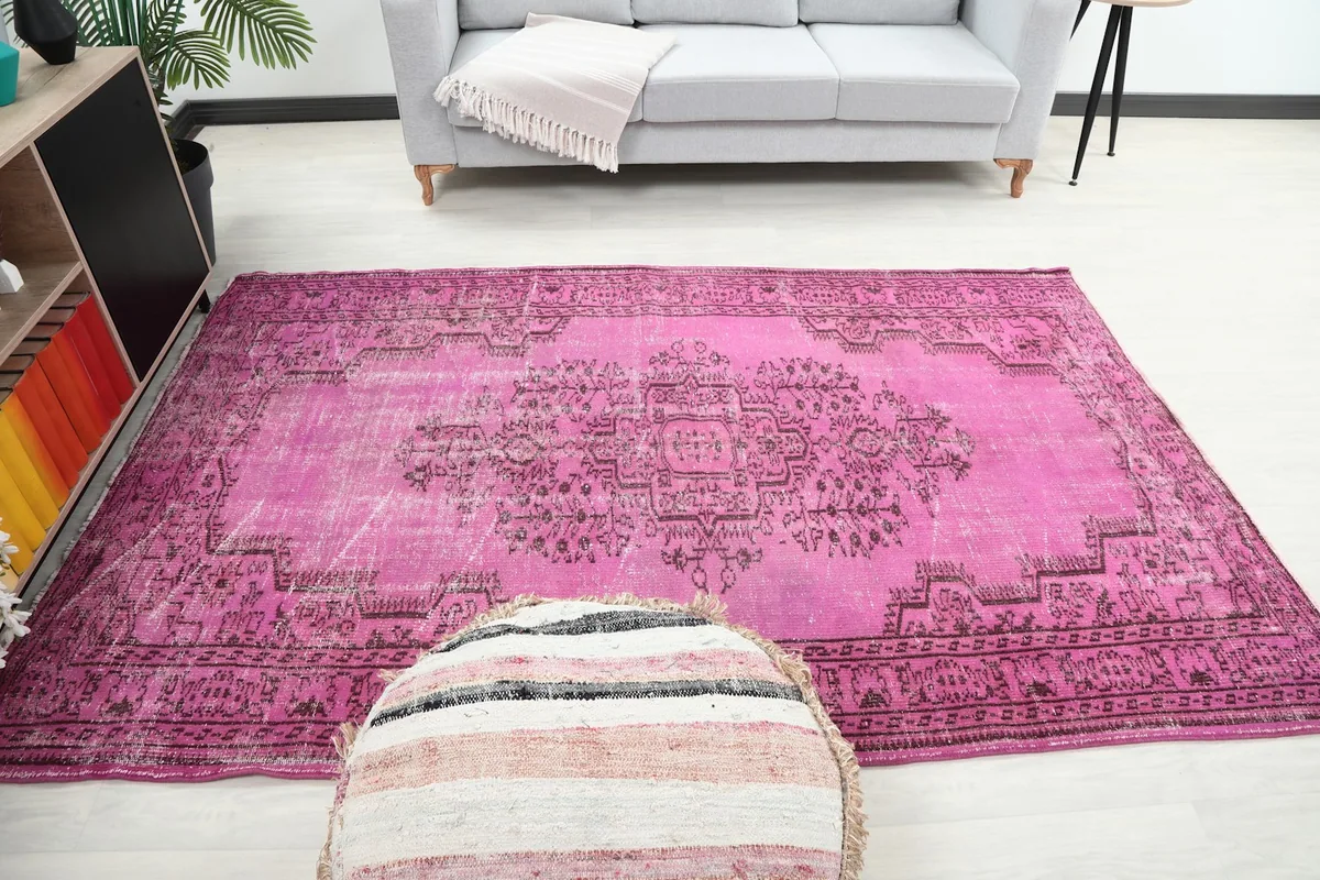 Full room view of the pink rug, demonstrating its impact as an area rug