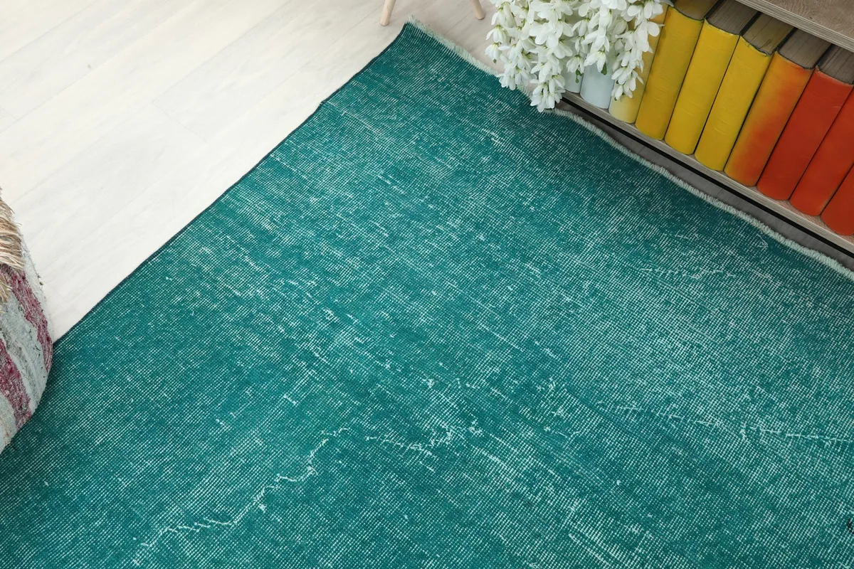 Corner view of the blue rug illustrating its placement in a room