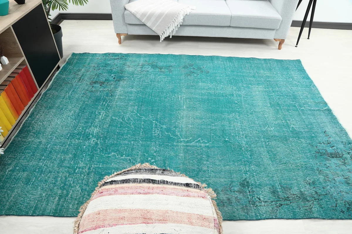 Full room view of the blue distressed rug complementing the decor