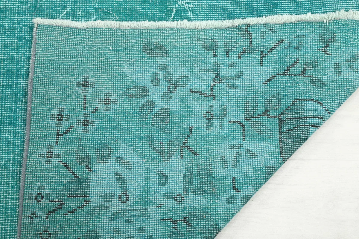 Close-up of the hand-knotted wool pile on cotton foundation from the back