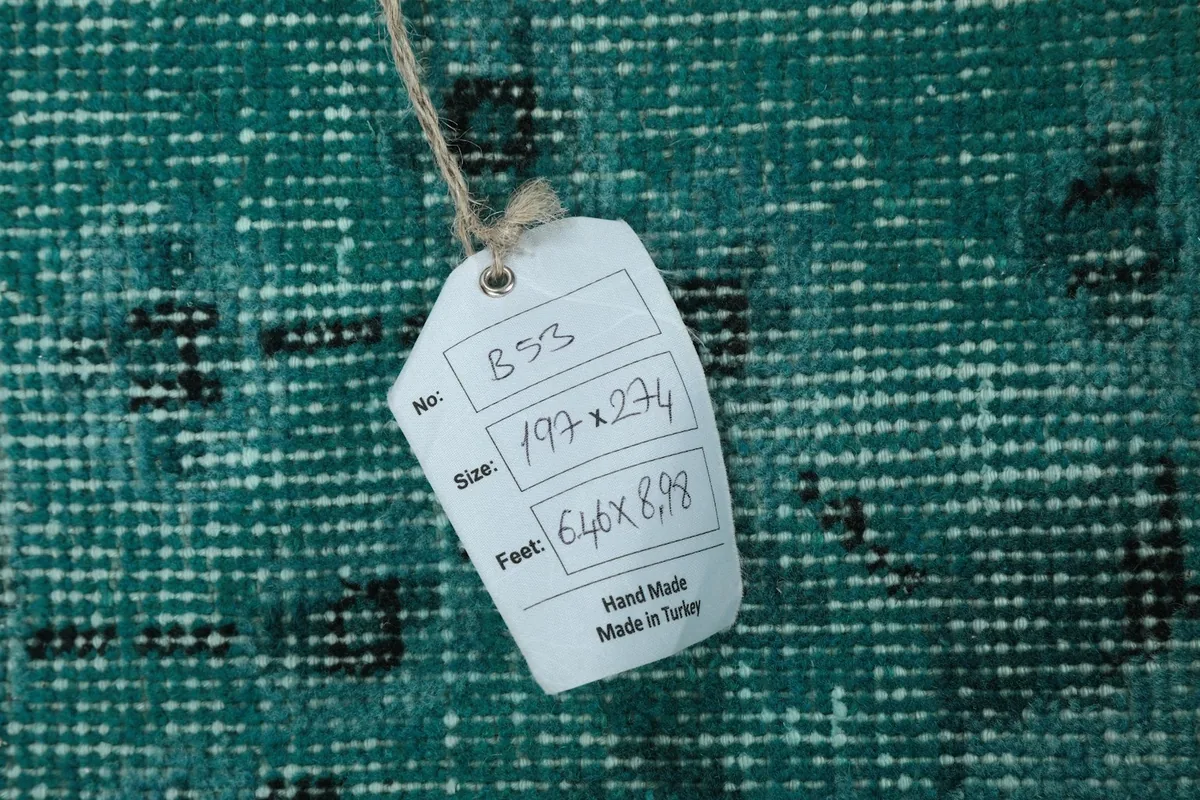 Product tag displaying rug dimensions and origin details