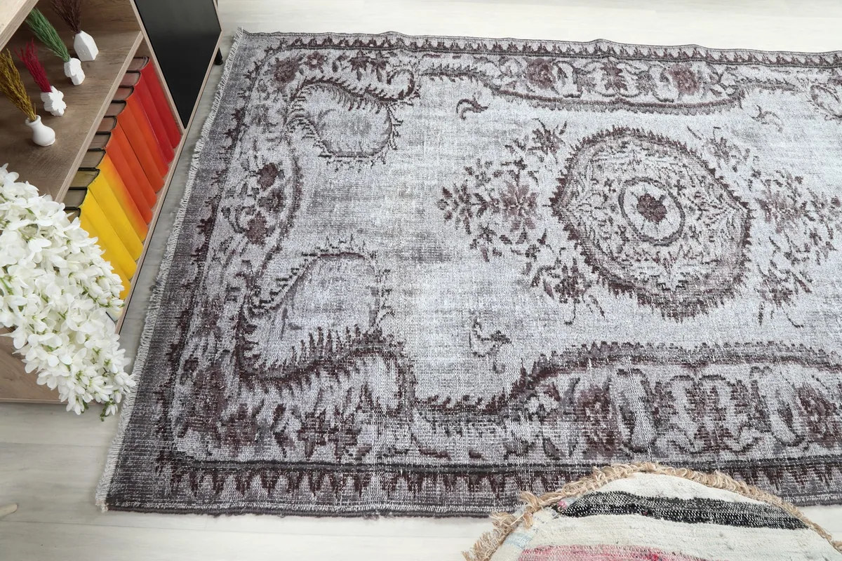 Wide angled view of the rug within a decorated living space.