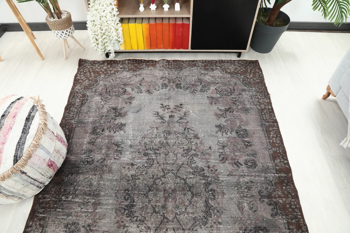 Overhead view of the Faded Charcoal Floral Anatolian Rug in the room
