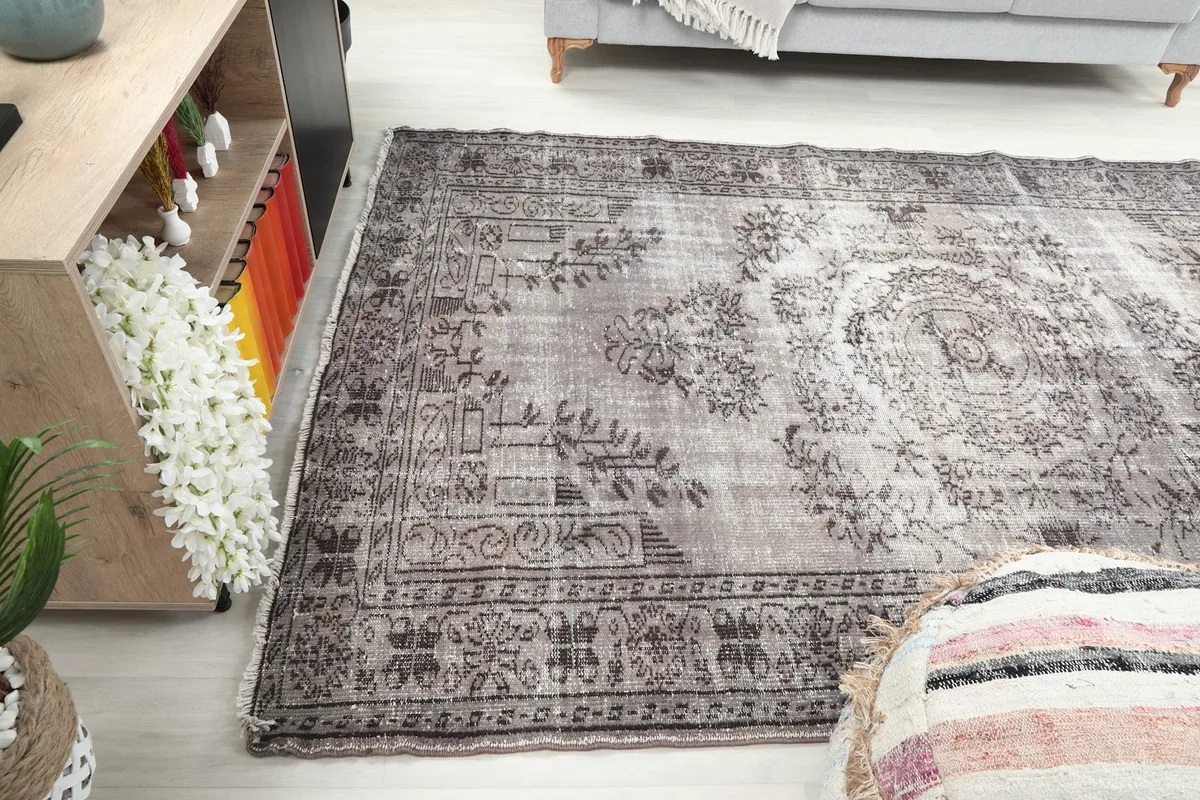 Wide angle view of the rug in a room, showing its placement relative to furniture