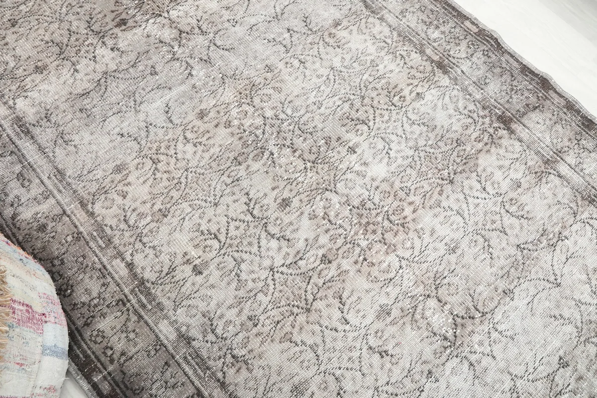 Overhead angle shot showcasing the full pattern and tonal variations of the gray rug