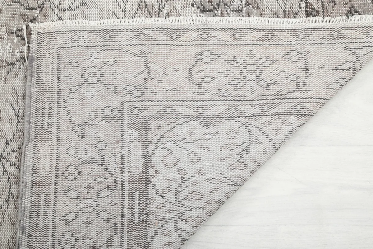Underside of the rug and a glimpse of the knotting, showing the craftsmanship