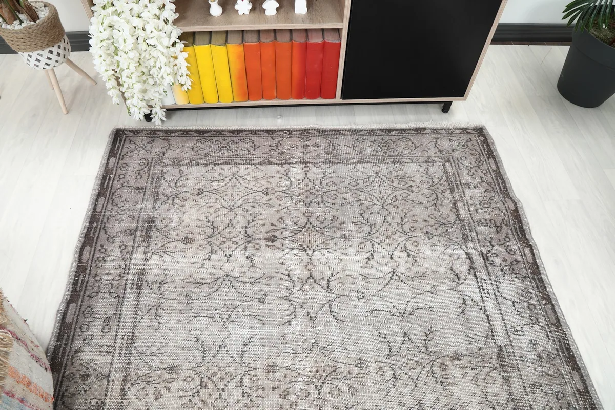Overhead view of the rug in a room setting, showing its placement relative to furniture