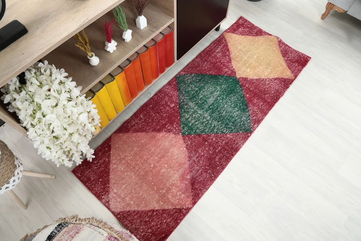Angled view of the entire runner rug, highlighting its length and pattern.