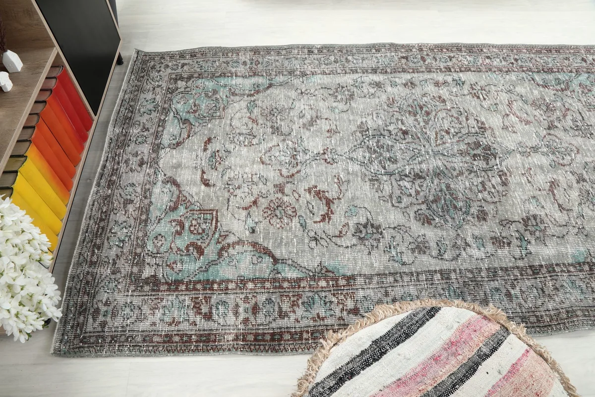 Wide shot of the rug in a room setting, showing its placement relative to furniture