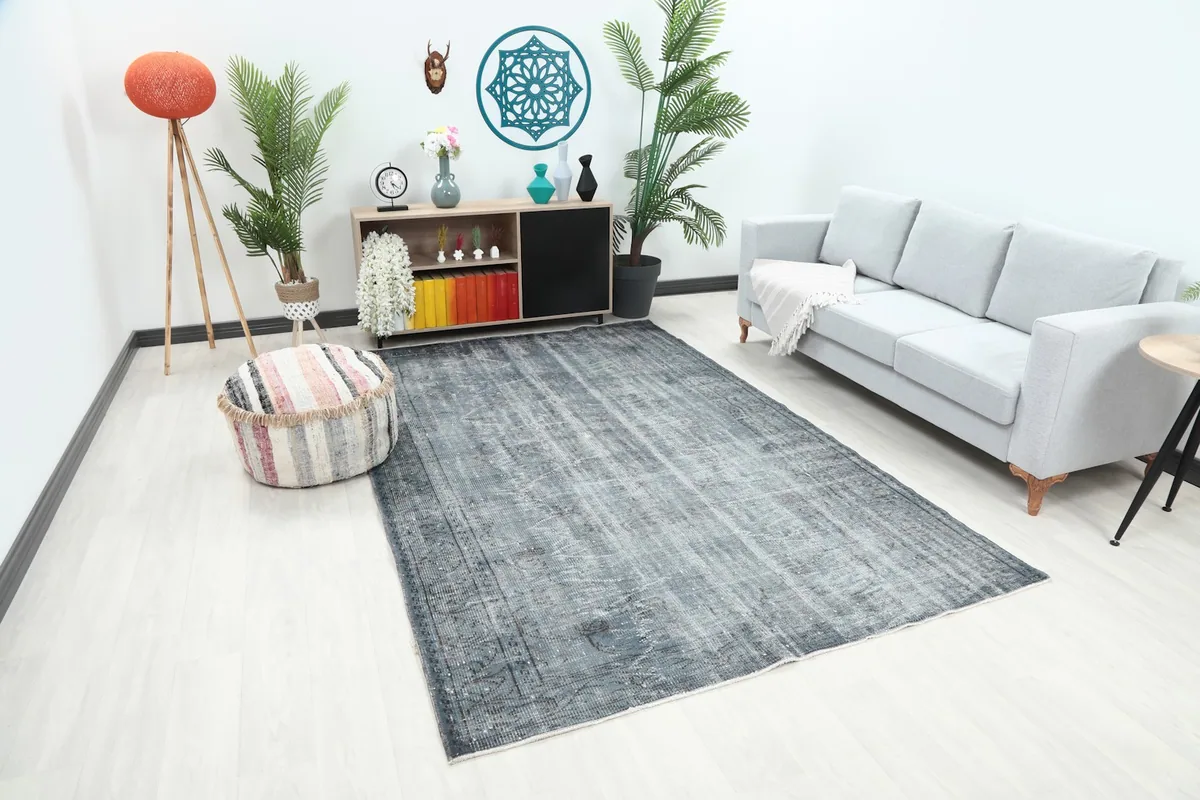 Angle view of the distressed Anatolian rug in a room, highlighting its size and placement