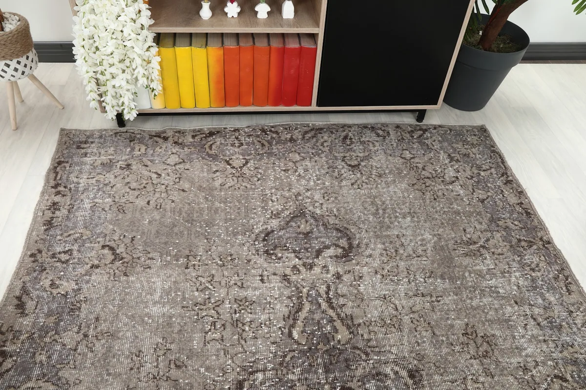Angled view of the rug's central medallion and overall pattern in a room setting