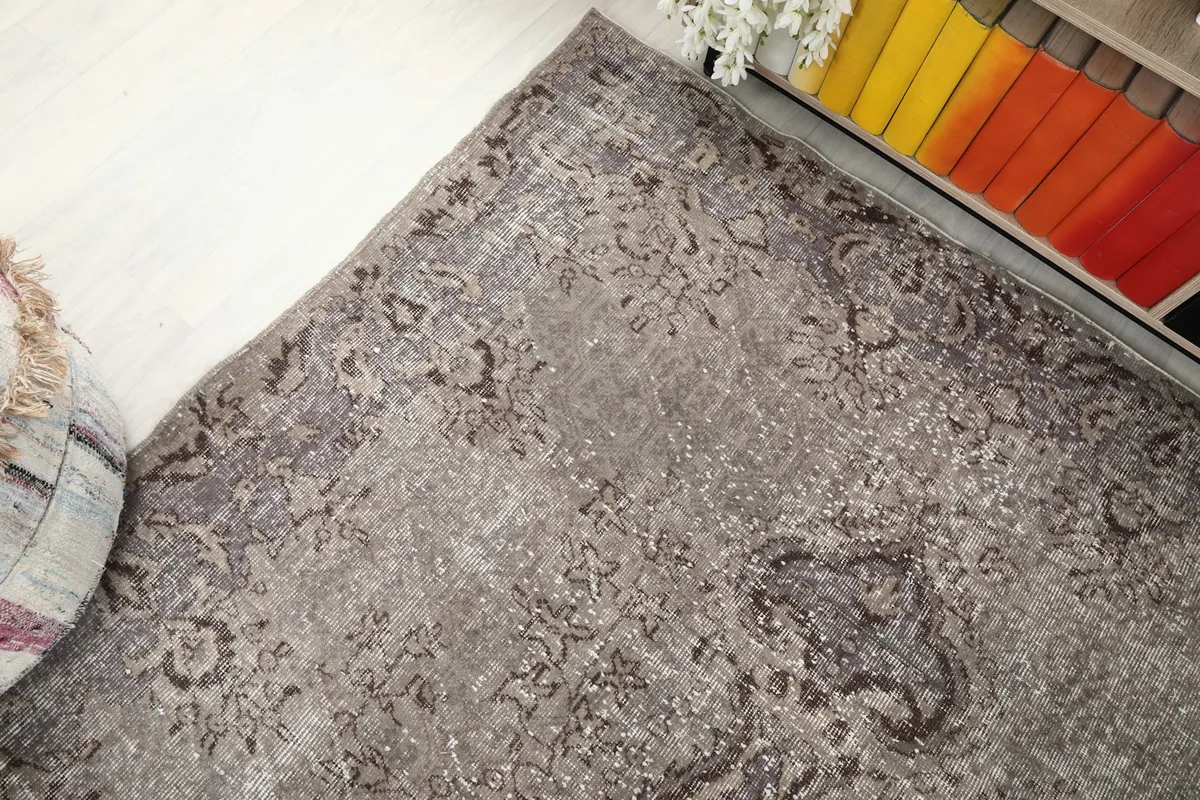 Top-down angle showcasing the rug's distressed surface and color transitions