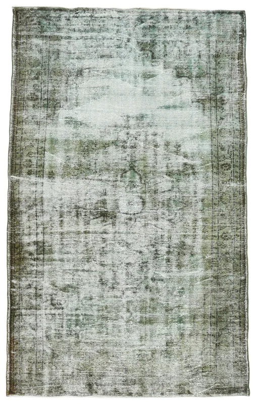 Full overhead view of the 5'3" x 8'7" vintage Anatolian rug with green and gray tones on a white background.