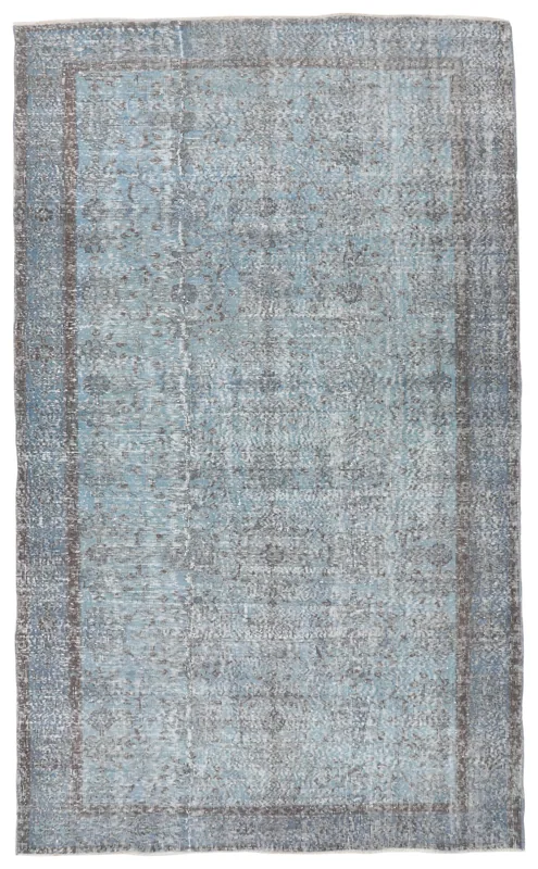 Full overhead view of the 5'8" x 9'5" blue distressed floral vintage Anatolian rug
