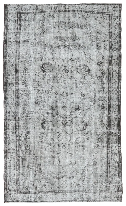 Full overhead view of the gray and charcoal medallion vintage Anatolian area rug