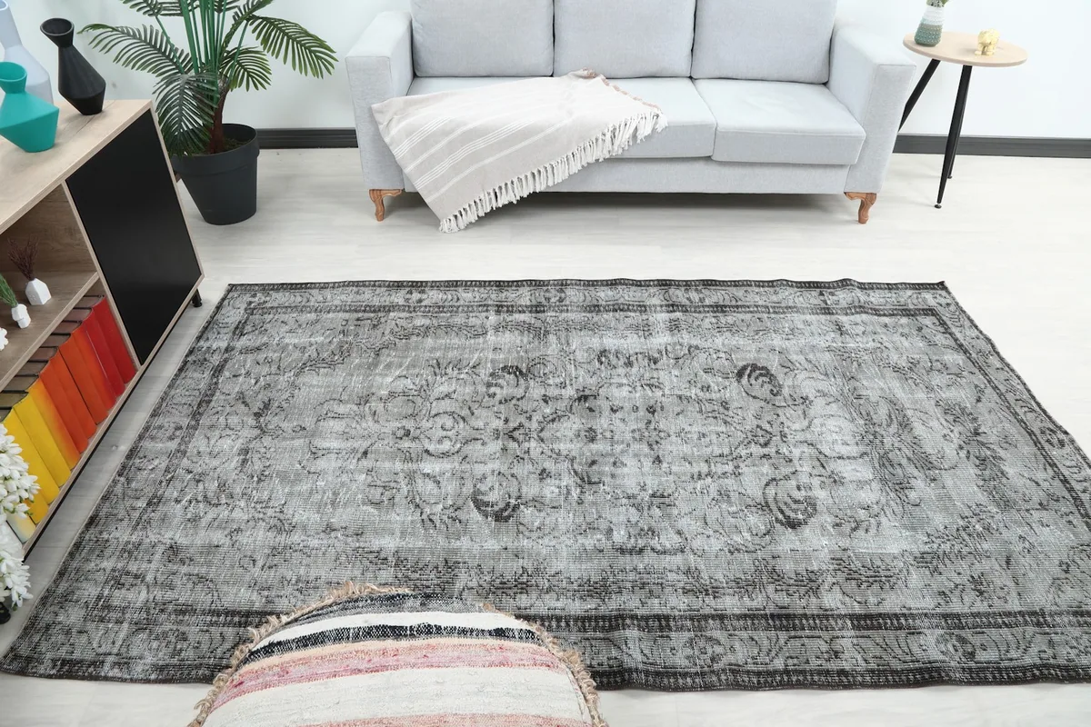 Wide shot of the gray vintage rug complementing a contemporary room setup