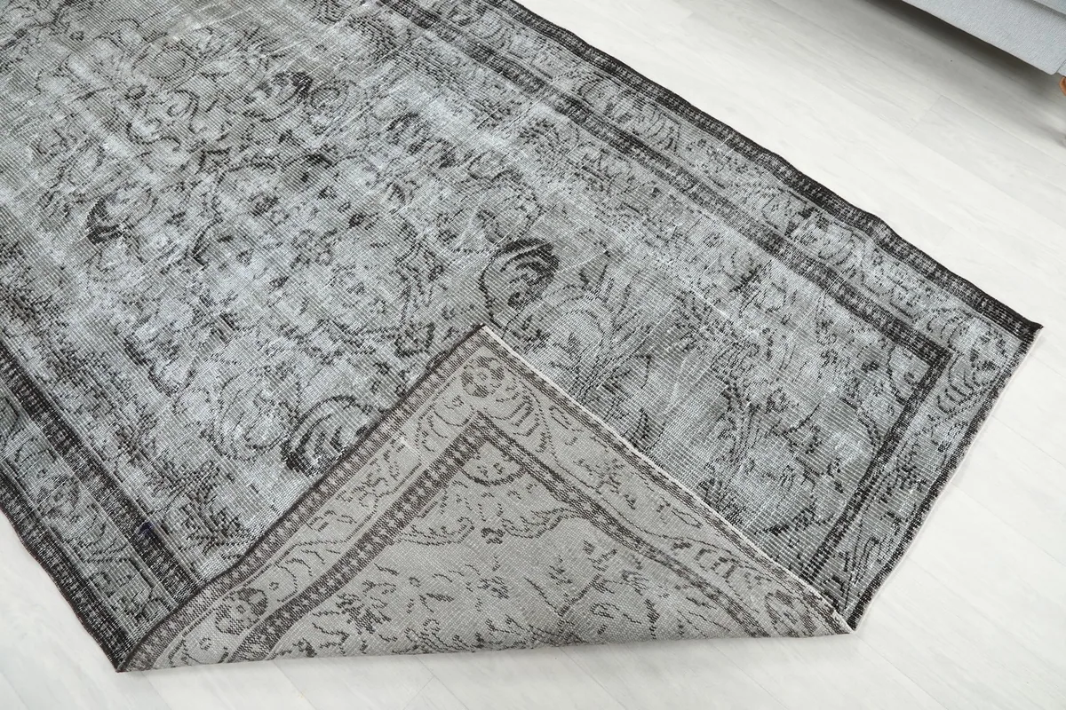 Folded corner of the rug showing the thickness and construction