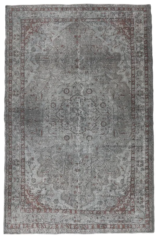 Full overhead view of the charcoal and rust vintage Anatolian area rug on a white background.