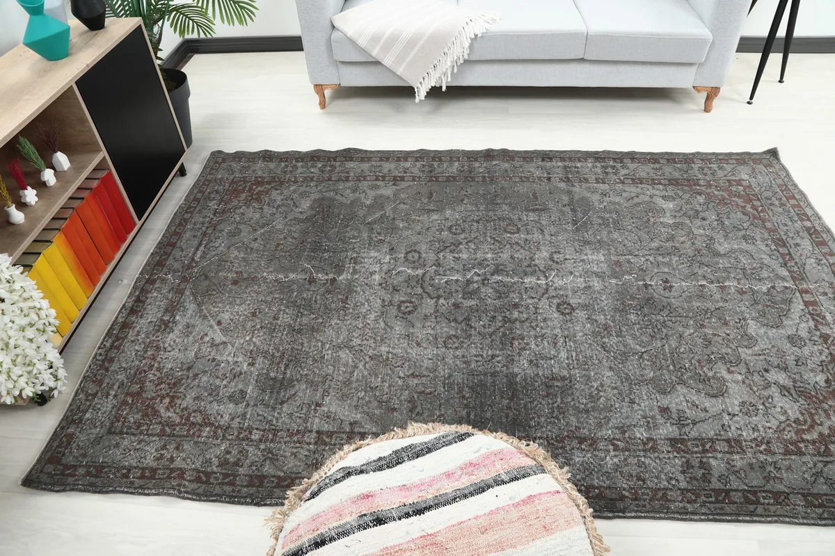 Wide shot of the rug in a room, demonstrating its medium size and how it anchors the space.