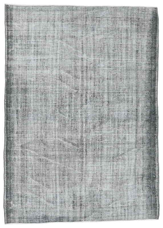 Full overhead view of the gray and charcoal vintage Anatolian area rug on a white background