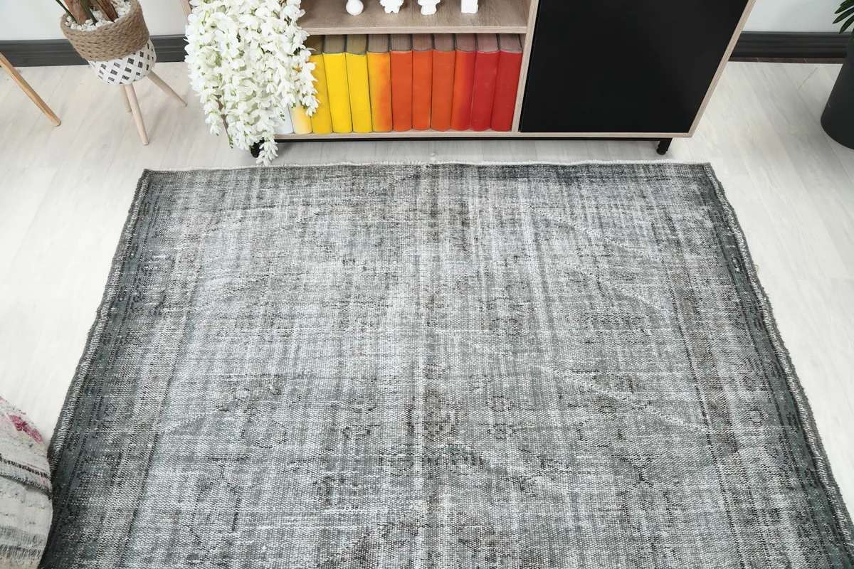 Overhead view of the vintage gray rug in the room, showcasing its full design