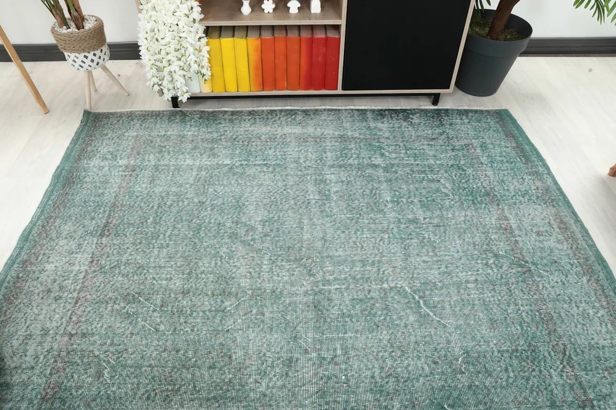 Overhead view of the rug in a room, showing its full length and width relative to the space.