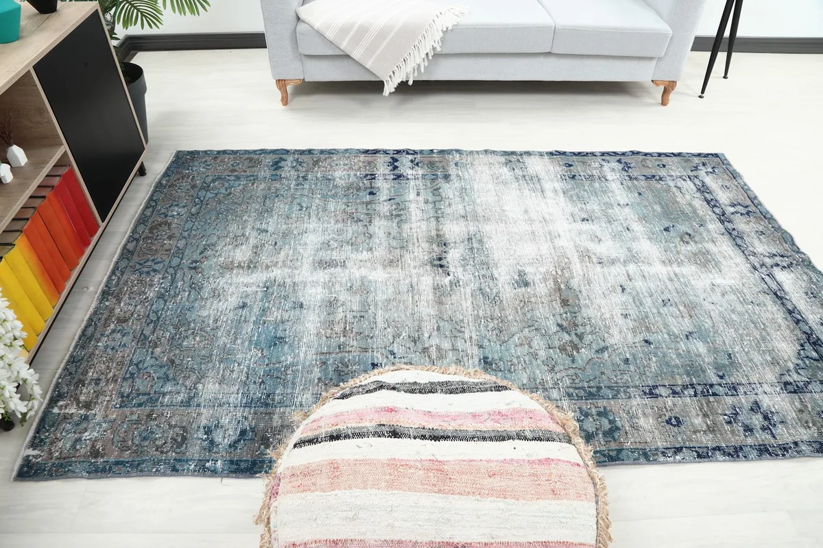 Full room view with the vintage Anatolian rug as a central feature