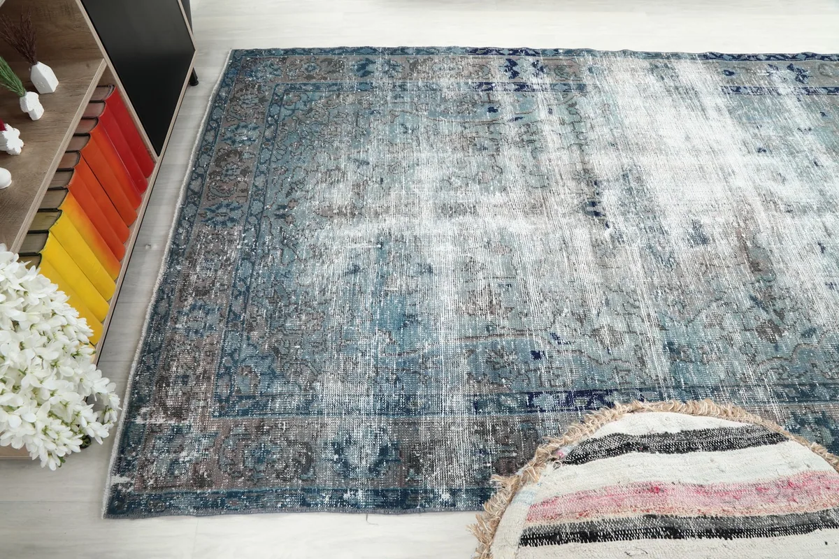 Wide overhead shot of the blue gray rug, emphasizing its size in the room