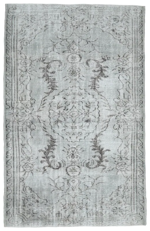 Full overhead view of the charcoal and gray vintage Anatolian rug on a white background.