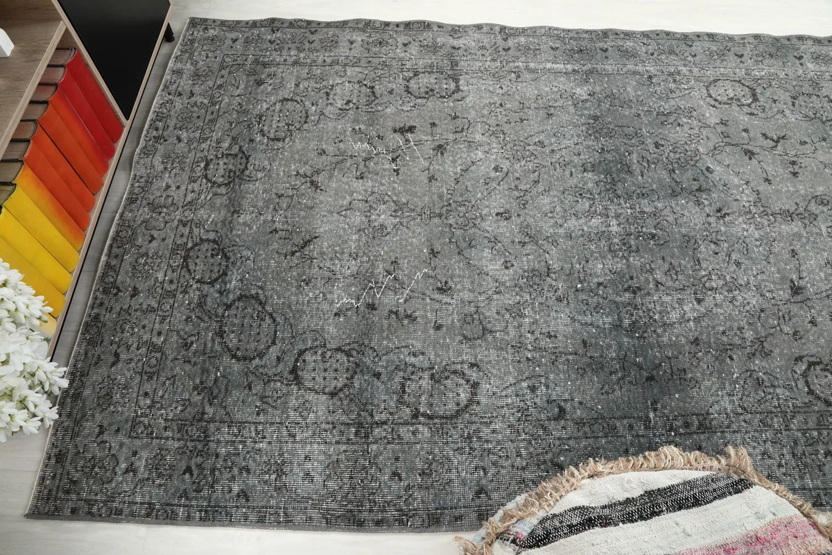 Wide angled view of the rug, capturing its length and the interaction with surrounding elements