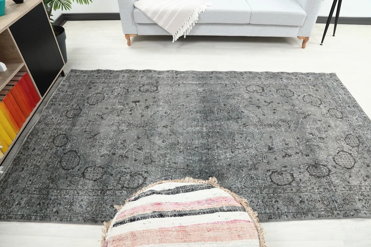 Full view of the charcoal gray rug in the living room setting from a slightly elevated angle