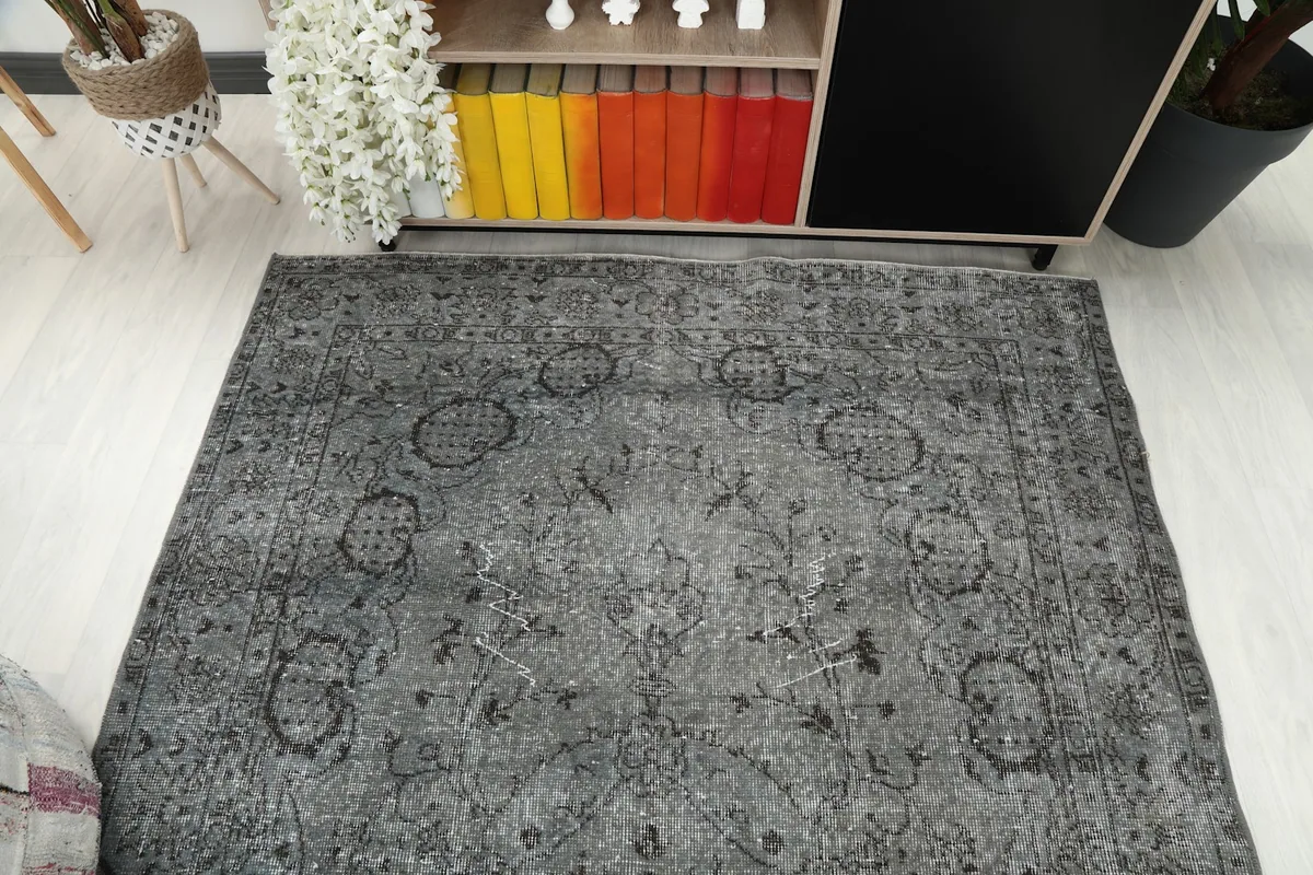 Overhead view of the rug positioned in the room, showing its full pattern and size