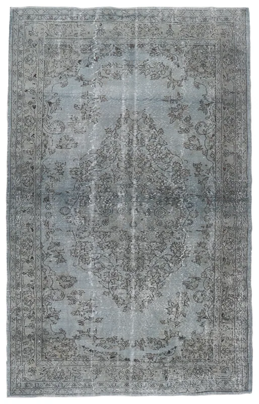 Full top view of the 5'7" x 9'1" blue and gray vintage Anatolian area rug