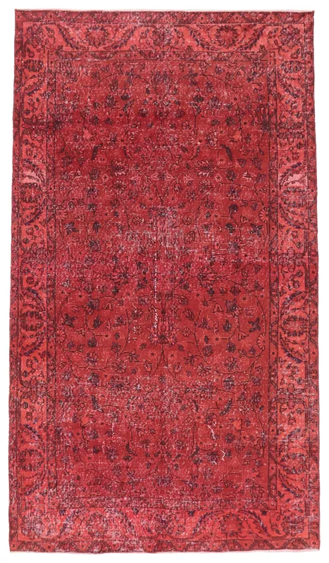 Full overhead view of the ruby red vintage Anatolian rug with floral motifs