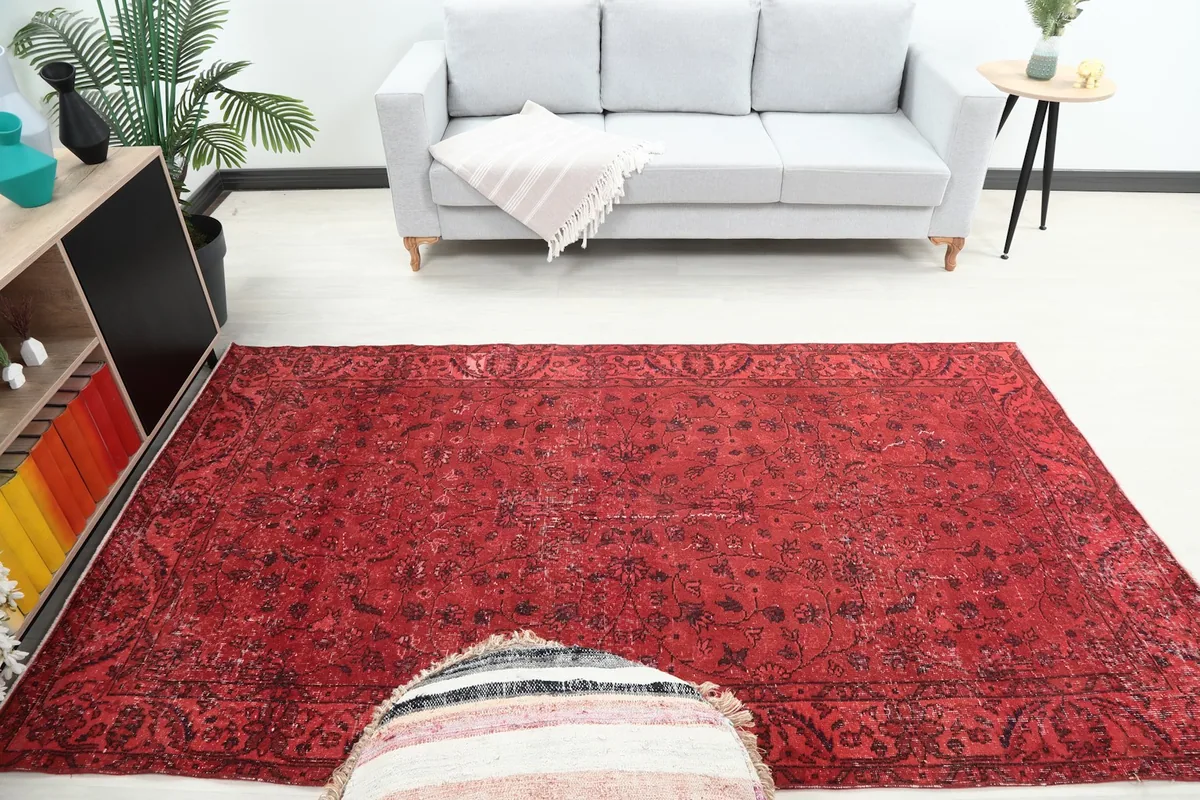 Full room view of the vintage ruby red rug complementing modern furniture