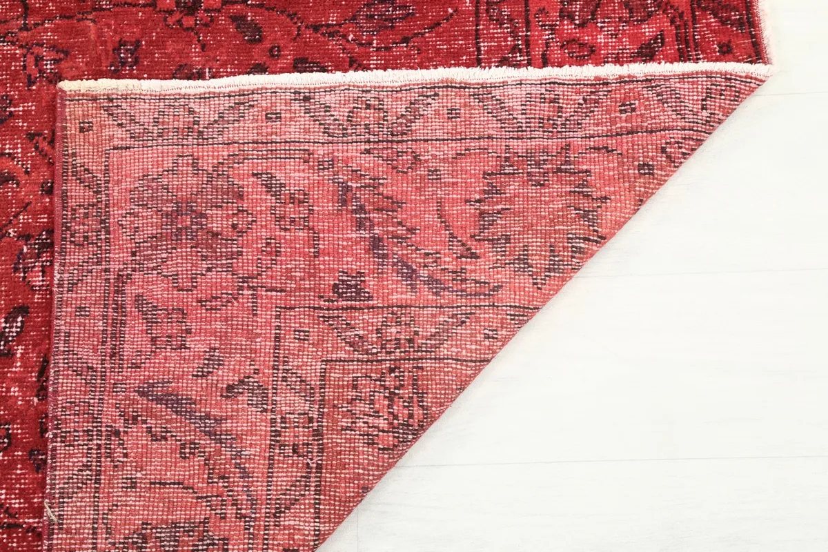 View of the rug's underside, revealing the cotton foundation and hand-knotting