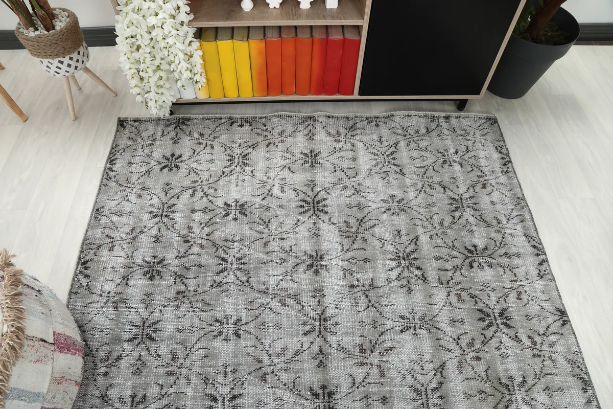 Gray Floral Anatolian Rug in a room, capturing its full length and width.