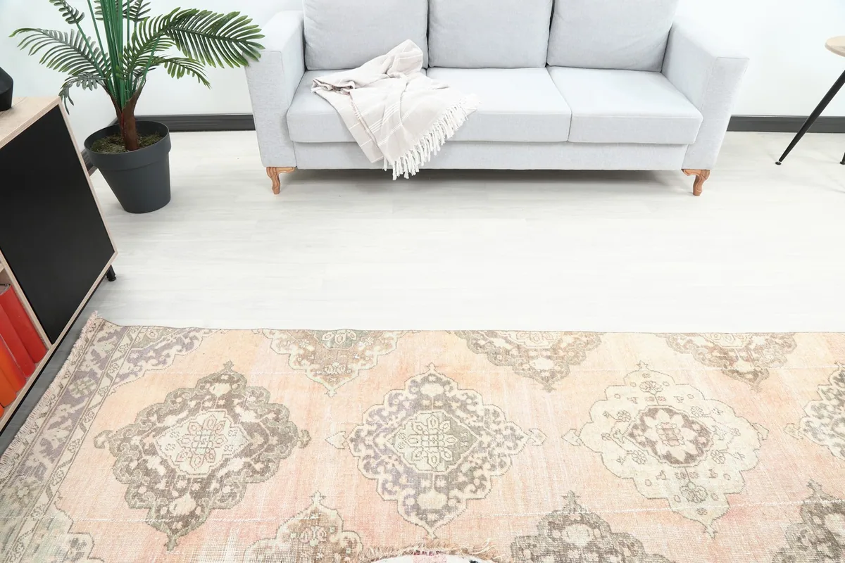 Overhead view showcasing the repeating medallion pattern and color variations across the rug