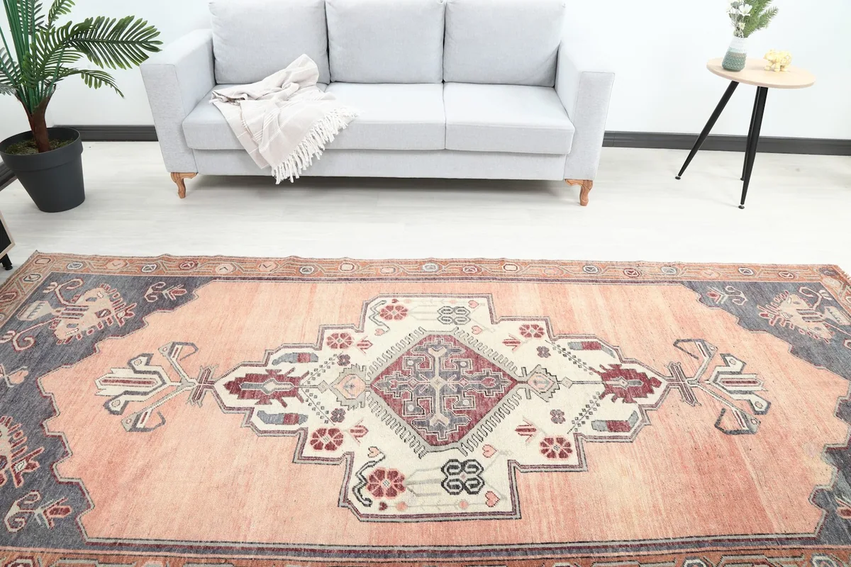 Overhead view of the orange runner's central medallion and patterns in a room