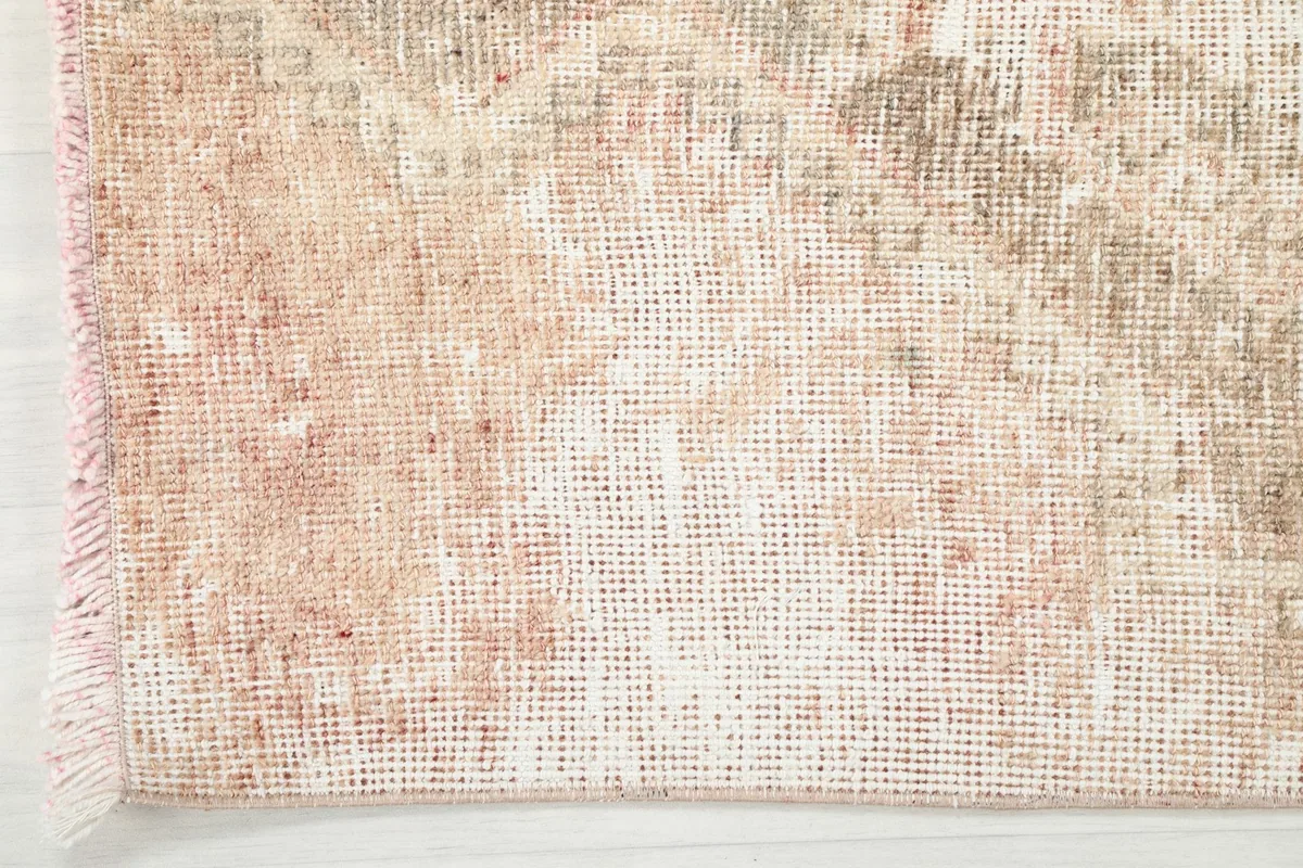 Detailed view of the low wool pile and texture of the hand-knotted runner rug