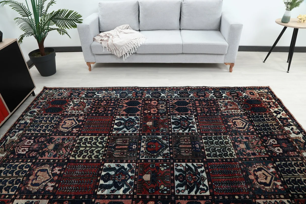 Overhead shot of the rug in a room, offering a broad perspective of its full design and proportions.