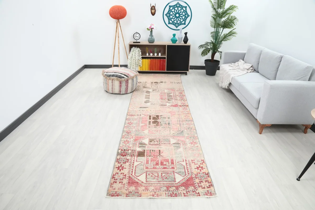 Vintage Anatolian runner in a modern living space, showing its full length and colors
