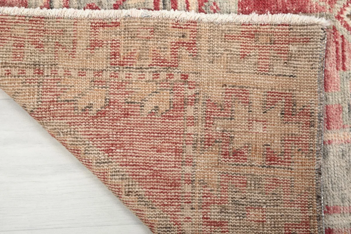 Underside of the runner, showing the tightly woven cotton foundation