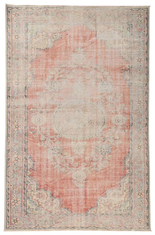 Full overhead view of the vintage Anatolian area rug with a faded rose field and beige medallion.