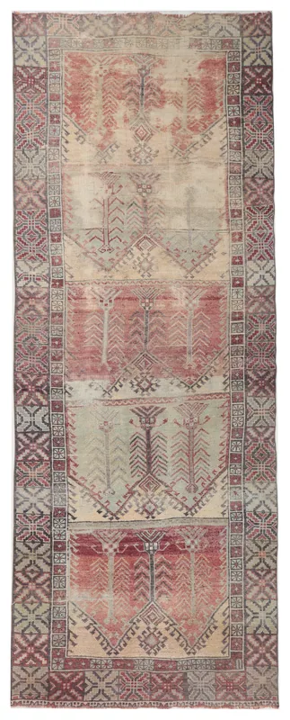 Full overhead view of the beige and rust vintage Anatolian runner on a white background